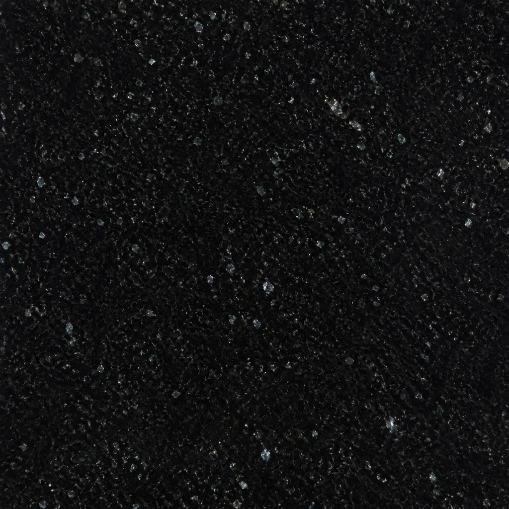 Close-up of premium Sarkan black granite with subtle silver mineral speckles and a polished surface